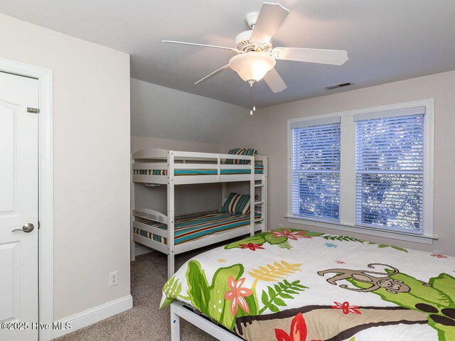 129 Sunset Dr, Cedar Point, NC 28584 - bedroom featuring visible vents, baseboards, vaulted ceiling, carpet floors, and a ceiling fan