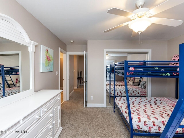 129 Sunset Dr, Cedar Point, NC 28584 - bedroom featuring baseboards, light carpet, and a ceiling fan