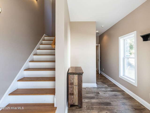 129 Sunset Dr, Cedar Point, NC 28584 - stairs featuring baseboards and wood finished floors