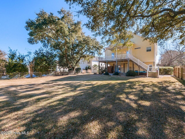 129 Sunset Dr, Cedar Point, NC 28584 - view of yard with stairway and a fenced backyard