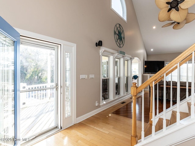 129 Sunset Dr, Cedar Point, NC 28584 - foyer with high vaulted ceiling, wood finished floors, recessed lighting, stairway, and baseboards