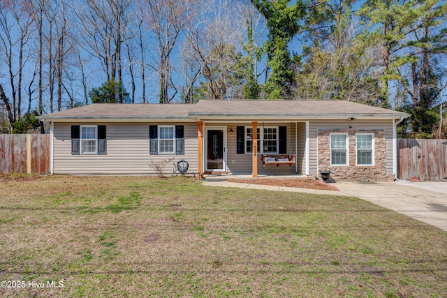 ranch-style home with stone siding, a porch, a front lawn, and fence