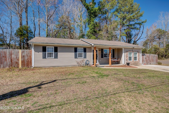 single story home featuring a front lawn, a porch, and fence