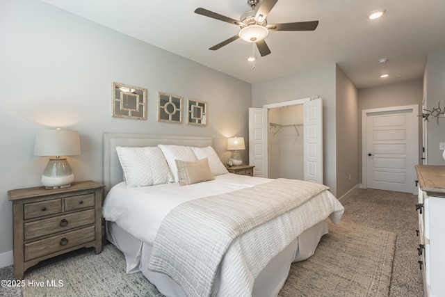 bedroom featuring recessed lighting, baseboards, a closet, and light carpet