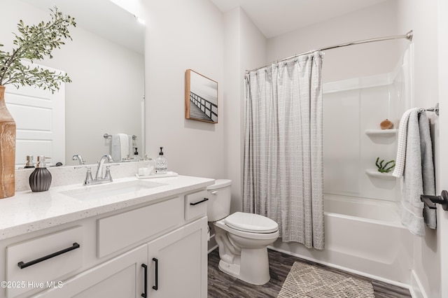full bathroom with wood finished floors, toilet, vanity, and shower / bathtub combination with curtain