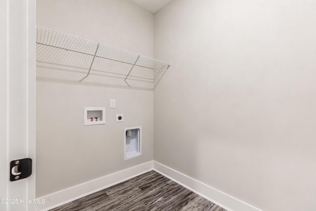 washroom featuring electric dryer hookup, washer hookup, dark wood finished floors, baseboards, and laundry area