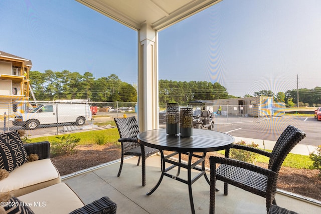 view of patio featuring fence