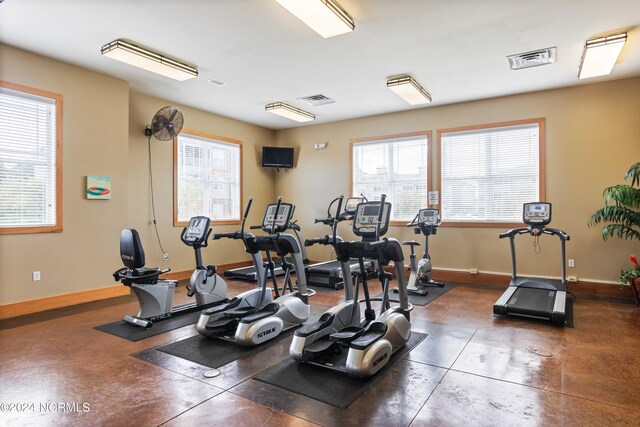 workout area featuring baseboards and visible vents
