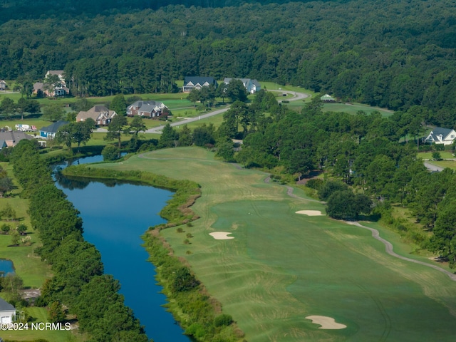 bird's eye view with a forest view and a water view