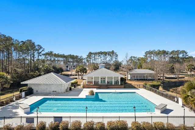 pool with a gazebo, fence, and a patio area