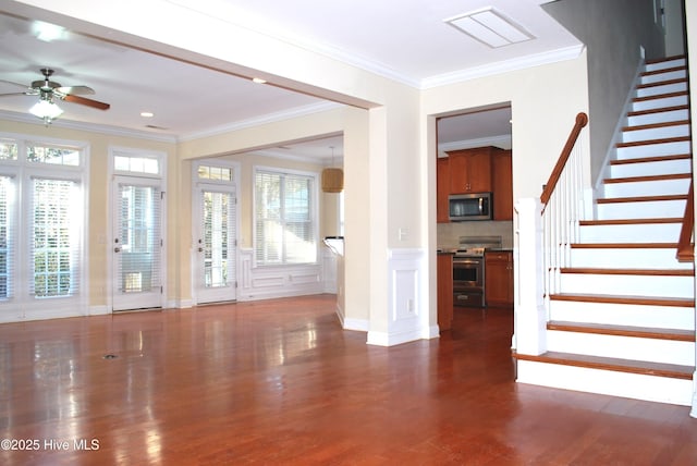 entryway with visible vents, ornamental molding, stairs, ceiling fan, and dark wood-style flooring