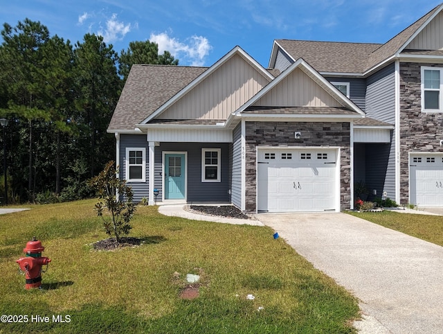 view of front of house featuring driveway, stone siding, board and batten siding, a front yard, and an attached garage