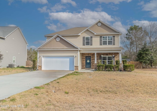 craftsman-style home with concrete driveway, a porch, a garage, and stone siding