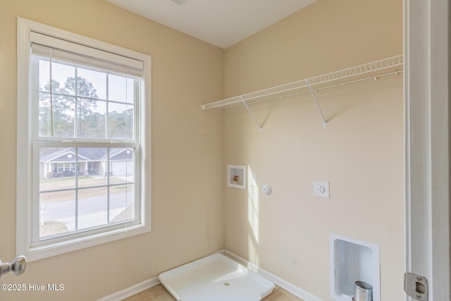 laundry area with laundry area, hookup for a washing machine, electric dryer hookup, and hookup for a gas dryer