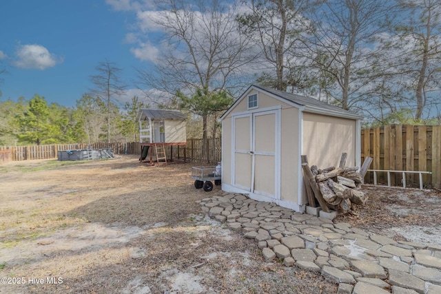 view of shed with a fenced backyard