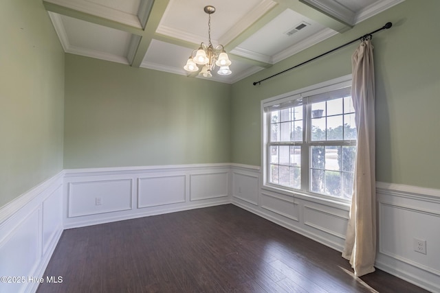 spare room with visible vents, a chandelier, beamed ceiling, coffered ceiling, and dark wood-style flooring