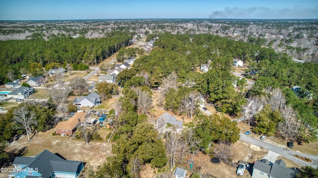 aerial view featuring a wooded view