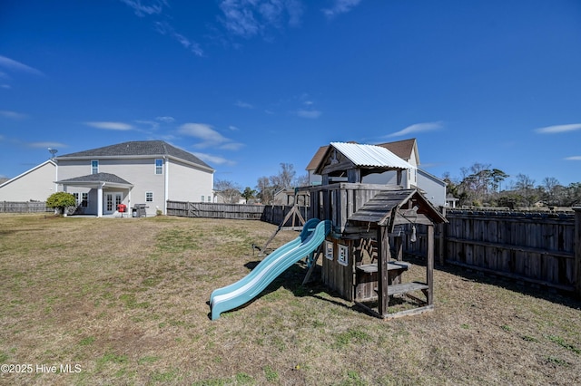 view of playground with a yard and a fenced backyard