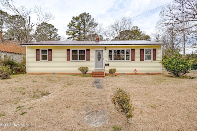 single story home featuring a front lawn, entry steps, metal roof, crawl space, and driveway