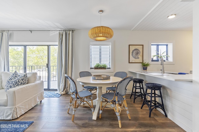 dining area with wood finished floors