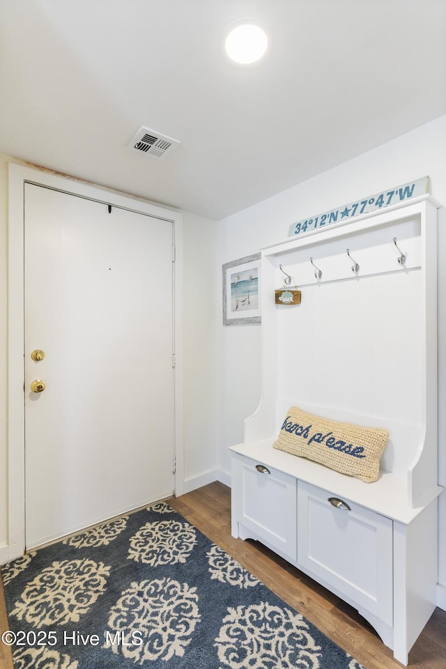 mudroom with visible vents and wood finished floors