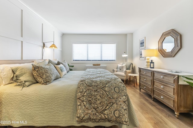 bedroom featuring light wood-type flooring