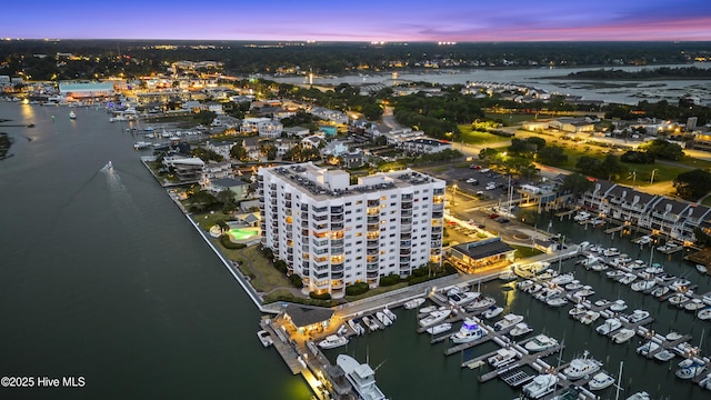 aerial view featuring a view of city and a water view