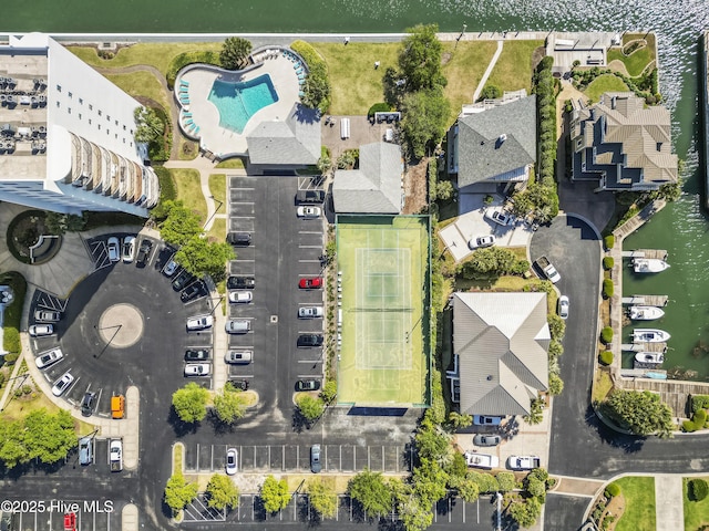 drone / aerial view featuring a residential view and a water view