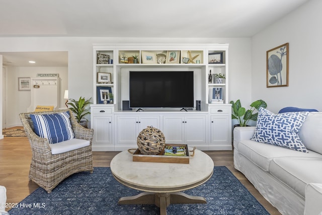 living room with wood finished floors