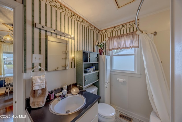 bathroom with visible vents, toilet, curtained shower, baseboards, and vanity