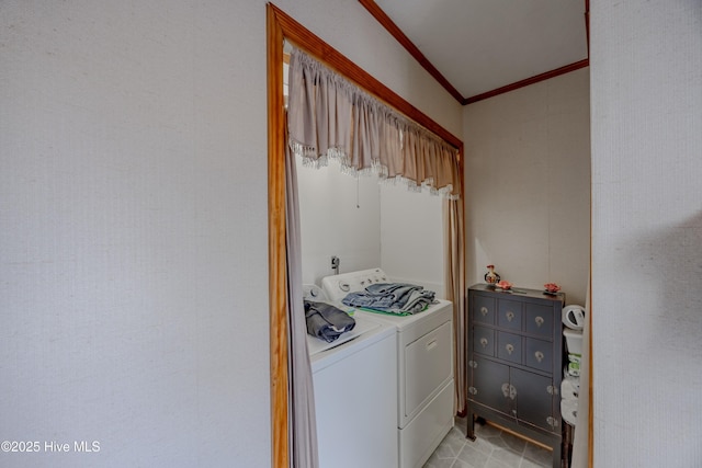 clothes washing area with laundry area, crown molding, and separate washer and dryer