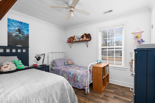 bedroom with visible vents, multiple windows, crown molding, and wood finished floors