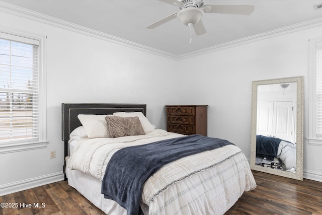 bedroom with visible vents, wood finished floors, baseboards, and ornamental molding