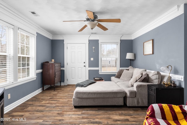 living room with crown molding and dark wood-type flooring