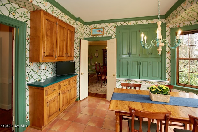 dining room featuring wallpapered walls, crown molding, a notable chandelier, and light tile patterned flooring