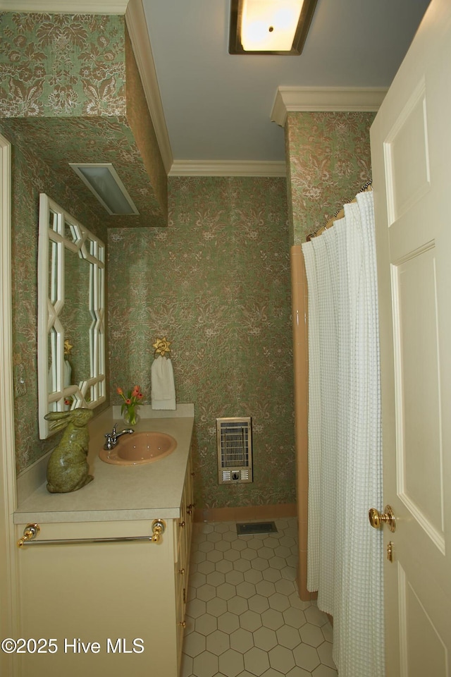 full bath with wallpapered walls, heating unit, vanity, and ornamental molding