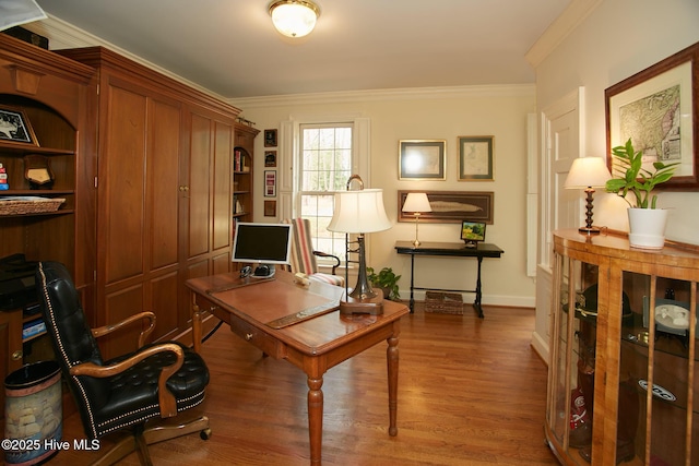 office space featuring wood finished floors, baseboards, and ornamental molding