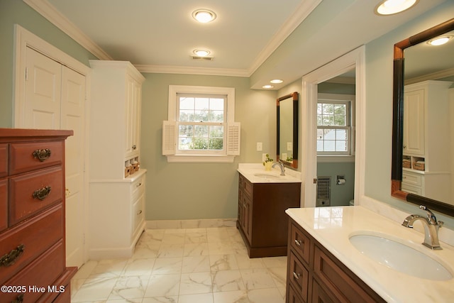 full bath featuring crown molding, baseboards, marble finish floor, and a sink