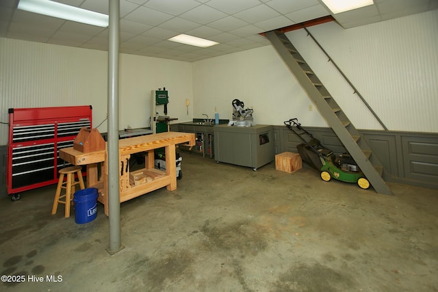 garage featuring fridge and a workshop area