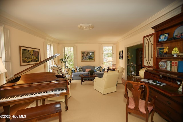 sitting room with carpet and crown molding