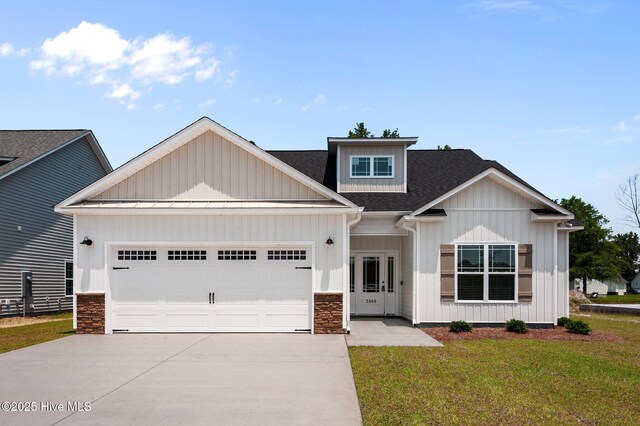 2366 Great Laurel Ct, Greenville, NC 27834 - craftsman-style house with driveway, a garage, board and batten siding, and a front lawn