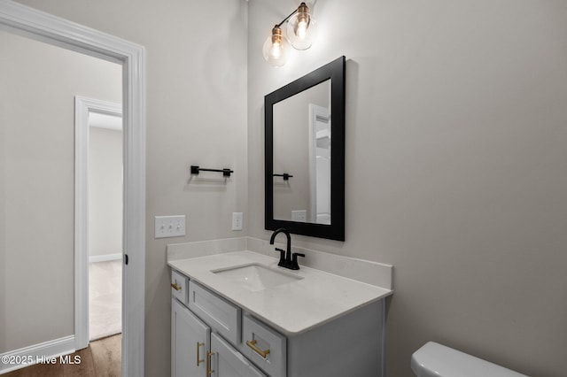 2366 Great Laurel Ct, Greenville, NC 27834 - half bath featuring vanity, toilet, and wood finished floors