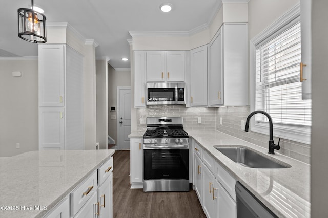2366 Great Laurel Ct, Greenville, NC 27834 - kitchen featuring stainless steel appliances, a sink, white cabinets, crown molding, and dark wood-style flooring