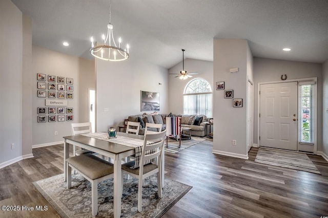 dining room with dark wood finished floors, recessed lighting, ceiling fan with notable chandelier, and baseboards