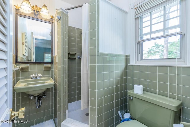 5218 Springwood Dr, Trent Woods, NC 28562 - full bathroom with a sink, a stall shower, toilet, and tile walls