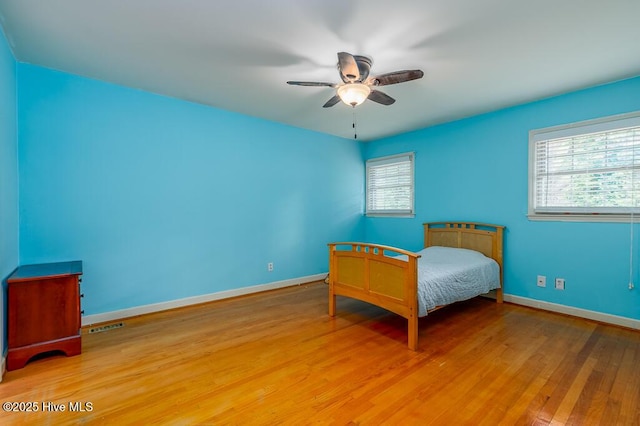 5218 Springwood Dr, Trent Woods, NC 28562 - bedroom with baseboards, multiple windows, light wood-type flooring, and visible vents