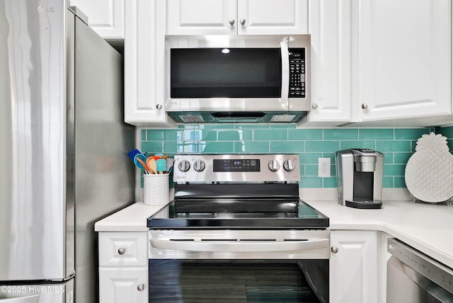 kitchen featuring light countertops, white cabinets, backsplash, and appliances with stainless steel finishes