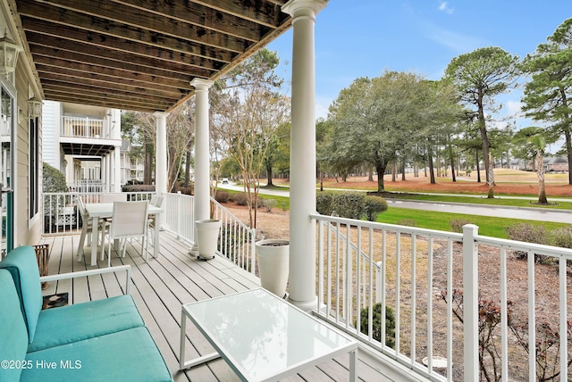 deck featuring outdoor dining area