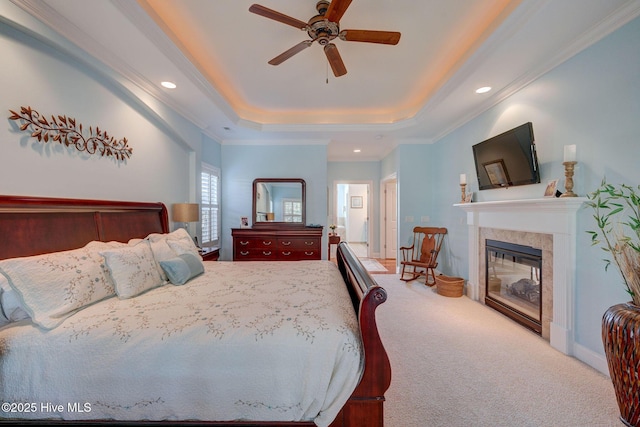 2184 Villamar Dr, Leland, NC 28451 - carpeted bedroom featuring a raised ceiling, crown molding, recessed lighting, and a fireplace