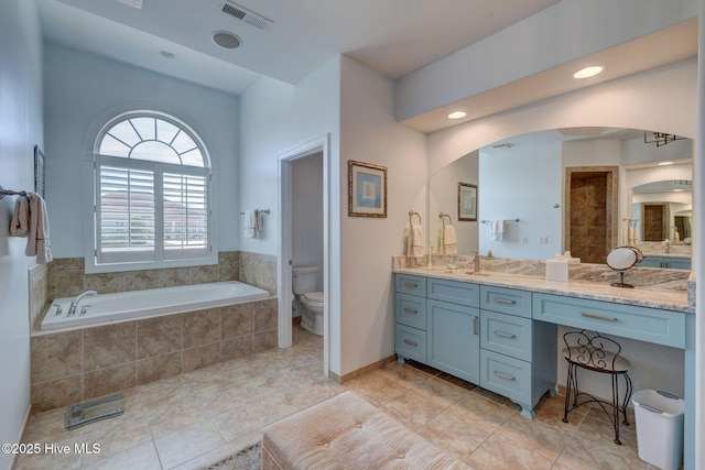 2184 Villamar Dr, Leland, NC 28451 - bathroom with visible vents, tile patterned floors, toilet, a bath, and vanity